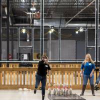Two alumnae fowling at the Fowling Fun Event